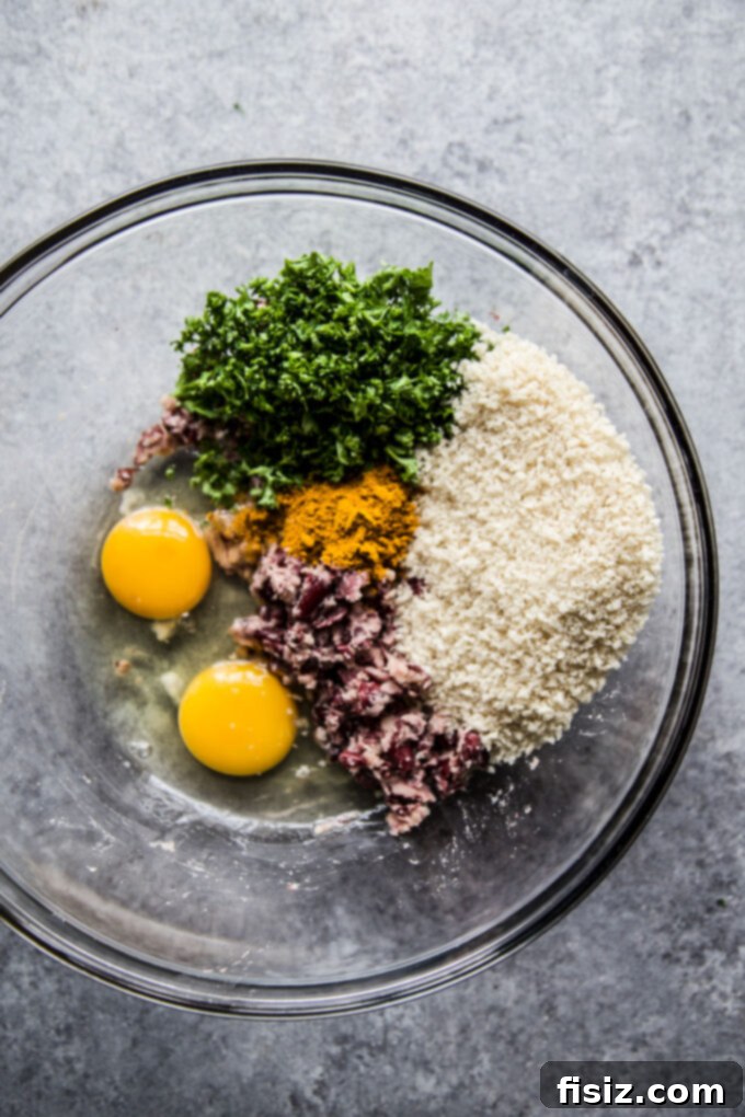 Aromatic Curry Plant-Based Burger 7 Mashing kidney beans in a bowl for the veggie burger mixture