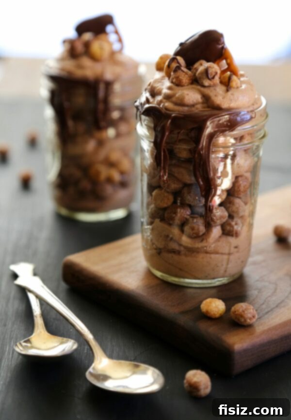 Can't Wait to Make These in February! 3 Decadent Chocolate Mousse Parfaits layered with Reese’s Puffs and crunchy Chocolate Covered Pretzels
