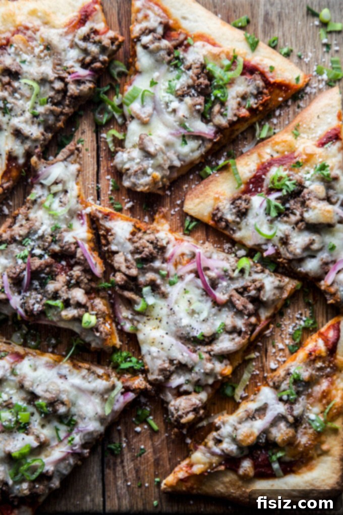 Caribbean Jerk Chicken Pizza 3 Jerk chicken pizza slices arranged on a wooden board, garnished with fresh cilantro, ready to be enjoyed.
