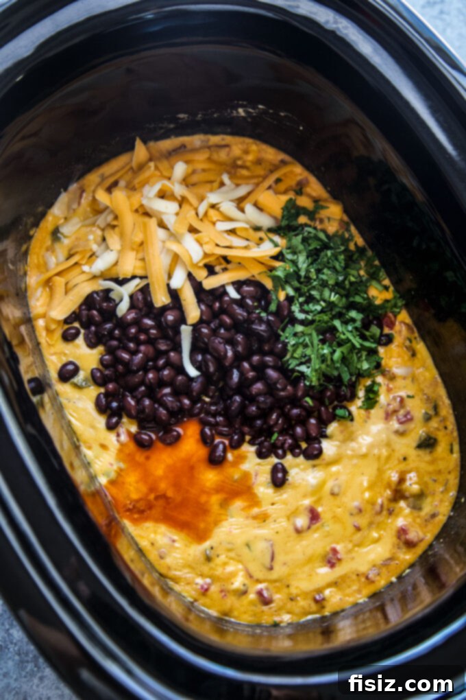 Creamy Slow Cooker Tex-Mex Queso 6 Diced Velveeta cheese ready to be added to the slow cooker