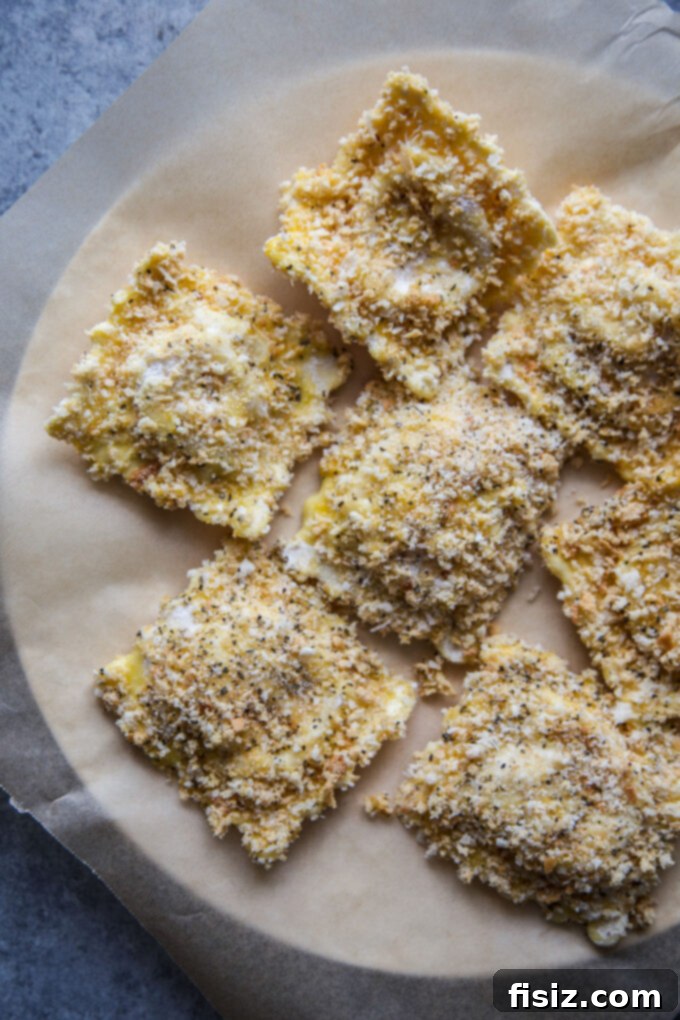 Air Fryer Four Cheese Ravioli Made Easy 6 Ravioli being coated in the breading mixture