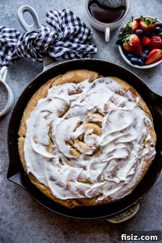 Giant Skillet Cinnamon Roll 2 Freshly baked Giant Skillet Cinnamon Roll with melted vanilla frosting