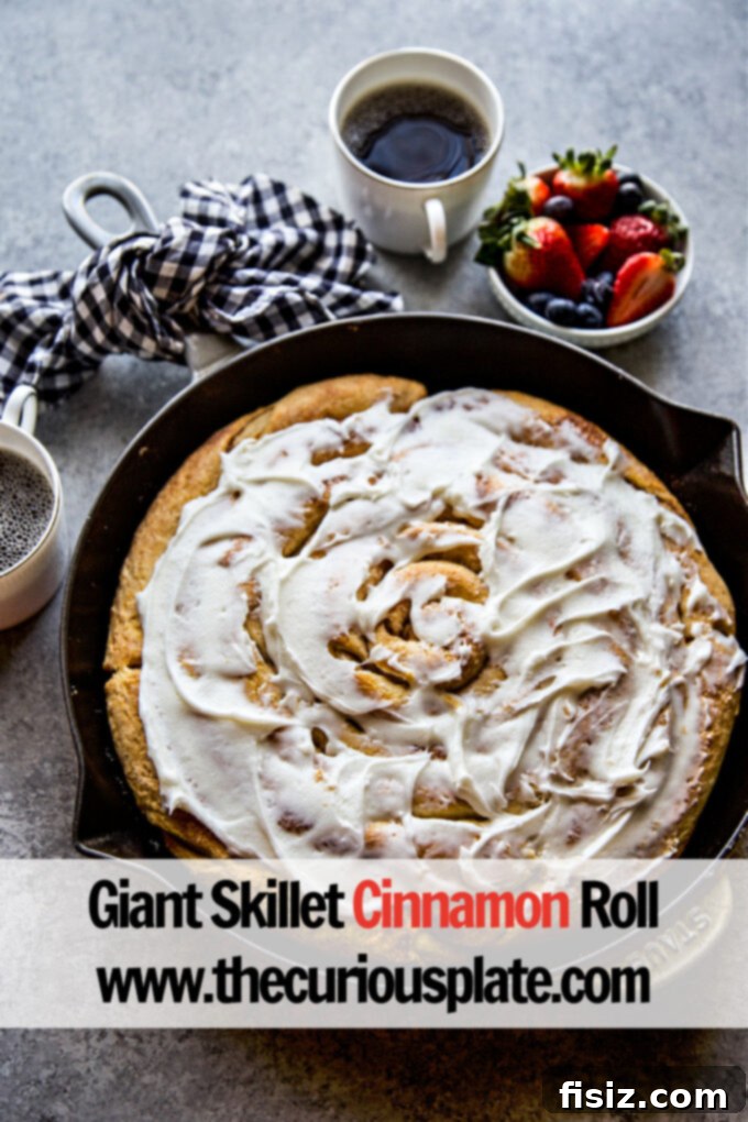 Giant Skillet Cinnamon Roll 11 Close-up of a slice of Giant Skillet Cinnamon Roll with melted frosting