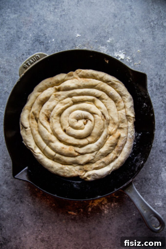 Giant Skillet Cinnamon Roll 7 Cinnamon sugar crescent dough cut into strips for rolling