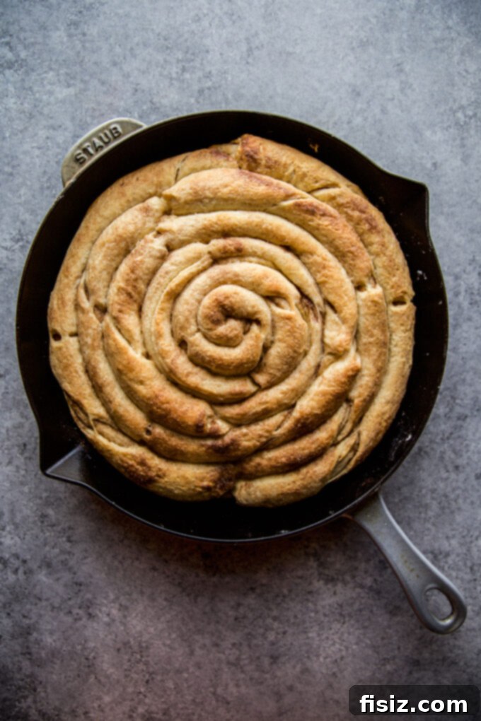 Giant Skillet Cinnamon Roll 8 Giant Skillet Cinnamon Roll being assembled in a cast iron skillet