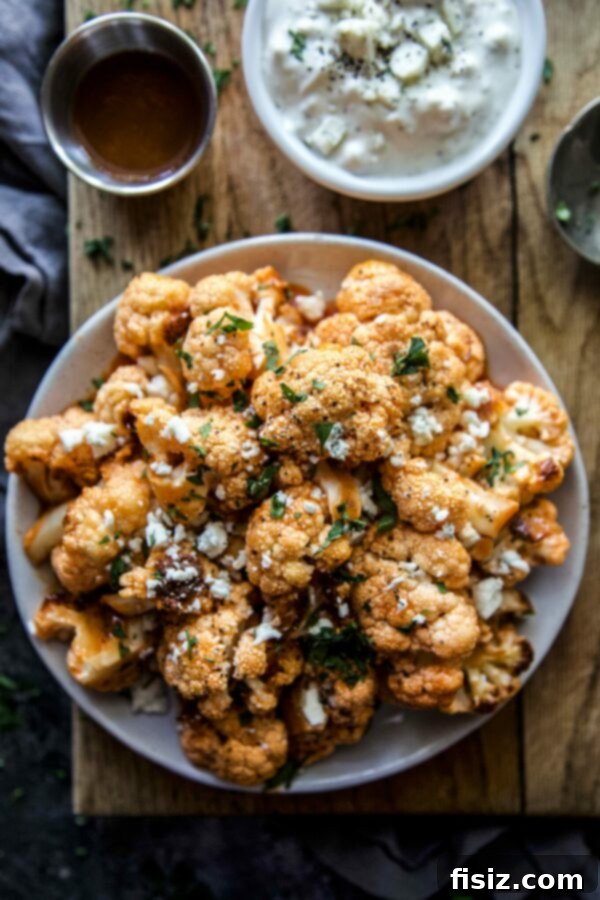Spicy and crispy Buffalo Cauliflower Bites served with a side of smoked blue cheese dip