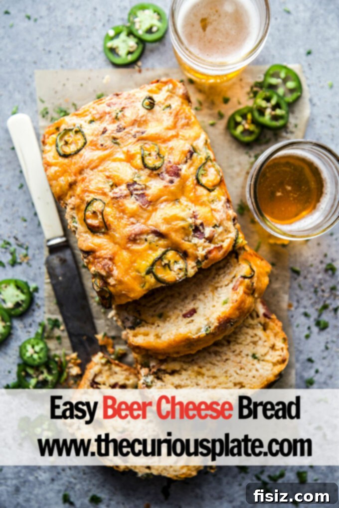 Quick Beer Cheese Bread 10 A final shot of the Easy Beer Cheese Bread, beautifully sliced and presented on a wooden board, ready for immediate serving and enjoyment.