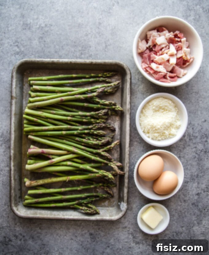 Spring Asparagus Carbonara 4 All the fresh ingredients laid out: crispy bacon, vibrant green asparagus, egg yolks, a pat of butter, and a mound of grated Parmesan cheese.