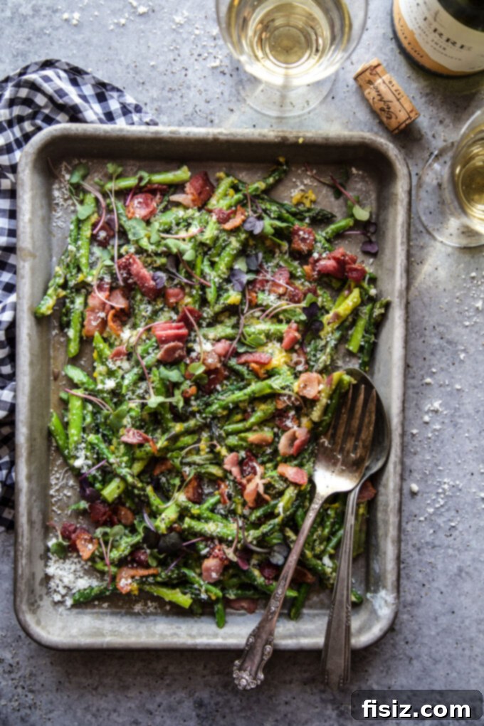 Spring Asparagus Carbonara 6 Finished Easy Asparagus Carbonara, featuring tender asparagus, crispy bacon bits, and a rich, creamy sauce, garnished with fresh herbs in a skillet.