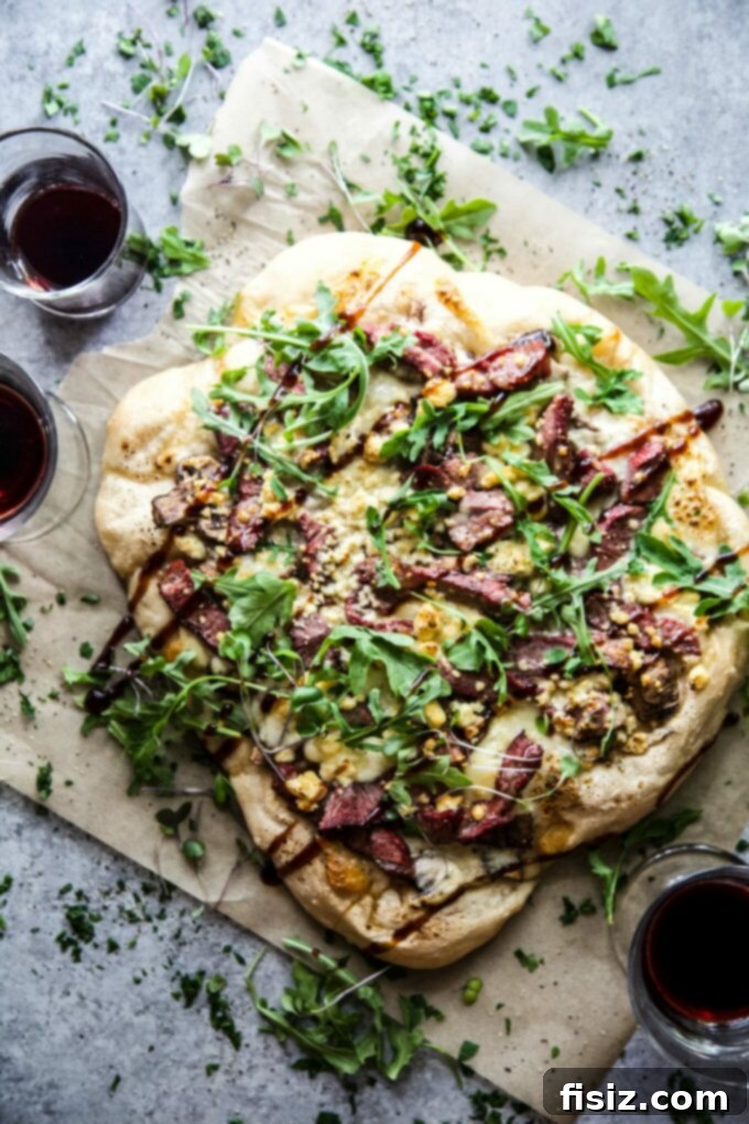 Grilled Steakhouse Lamb Pizza – A robust and flavorful dish perfect for spring gatherings, featuring tender lamb and fresh ingredients.