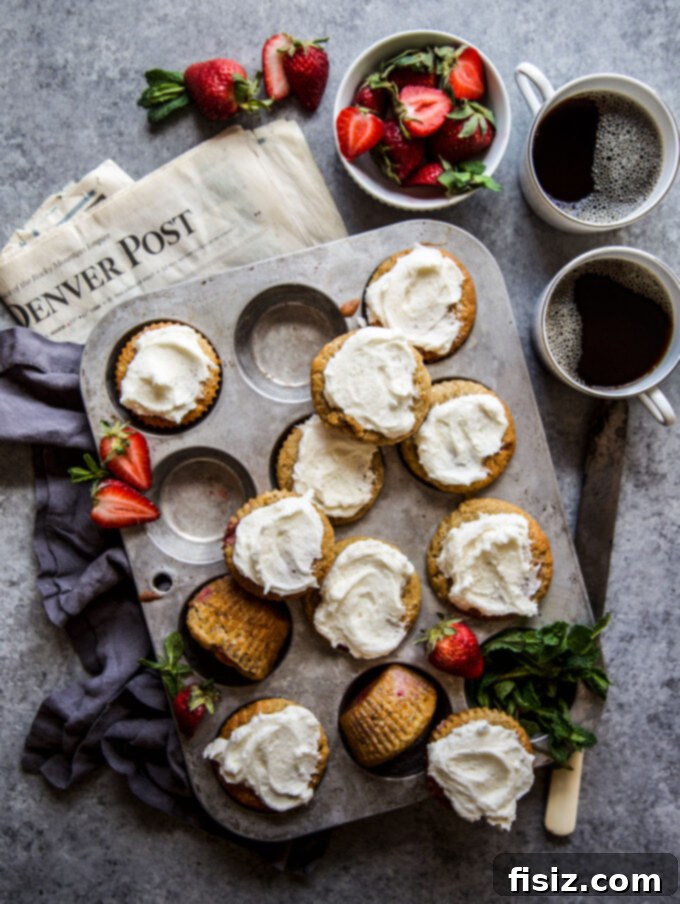 Delicious Strawberry Banana Bread Muffins with Vanilla Frosting, perfect for any time of day