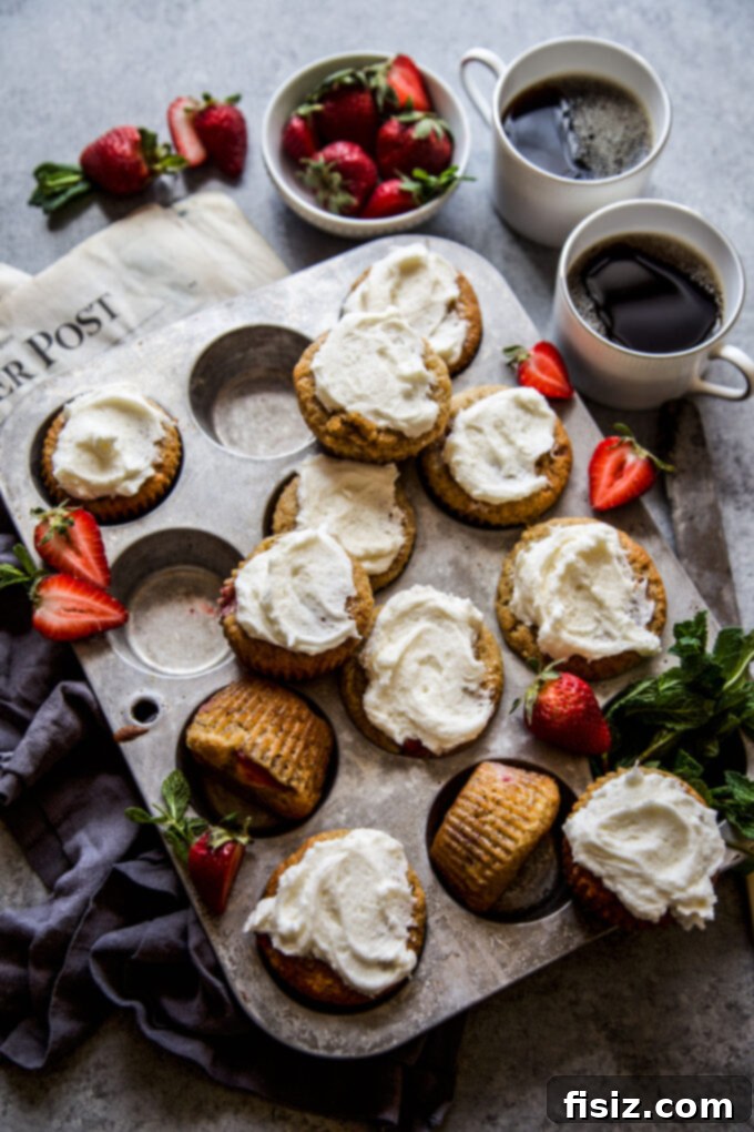 Beautifully arranged Strawberry Banana Bread Muffins with Vanilla Frosting, ready to be served