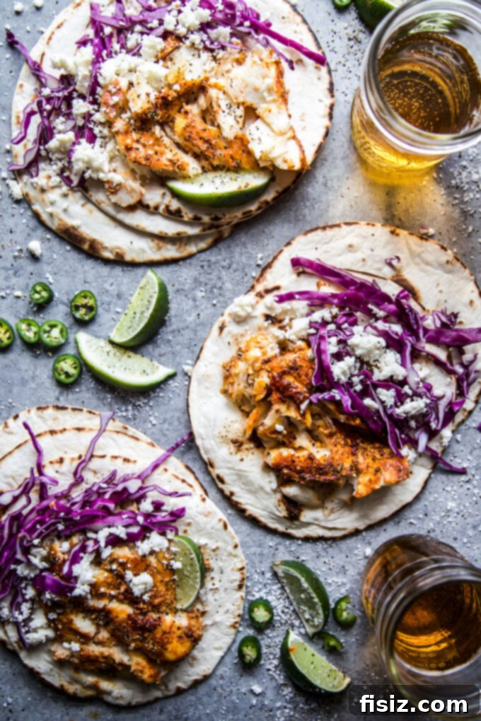 30 Festive Cinco De Mayo Recipes 3 A table filled with an array of Cinco de Mayo dishes, including tacos, dips, and cocktails, ready for a party.