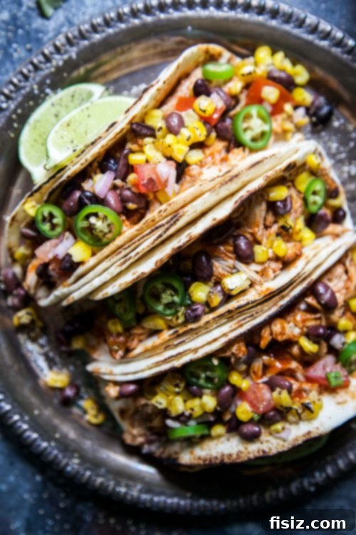 30 Festive Cinco De Mayo Recipes 8 Slow Cooker BBQ Chicken Tacos with Texas Caviar, a vibrant and easy meal for Cinco de Mayo.
