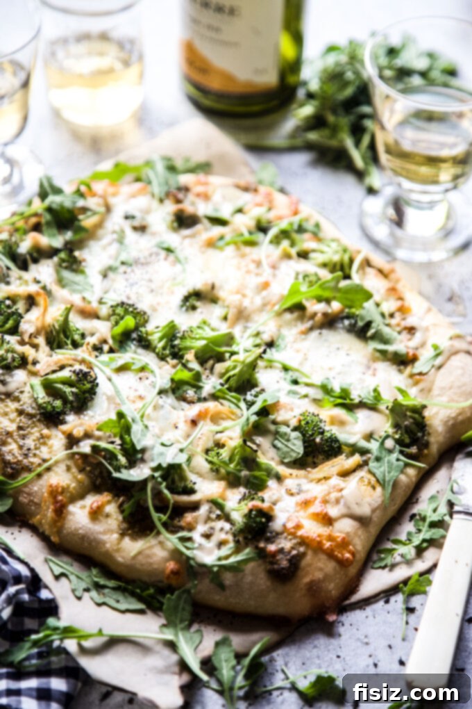 Vibrant Green Goddess Chicken Pizza 3 Green Goddess Chicken Pizza on a cutting board, ready to serve