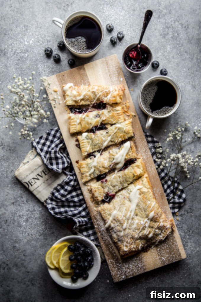 Flaky Blueberry Lemon Pastry 8 A beautifully composed shot of the Blueberry and Meyer Lemon Puffed Pastry Tart, ready to be served, emphasizing its aesthetic appeal.