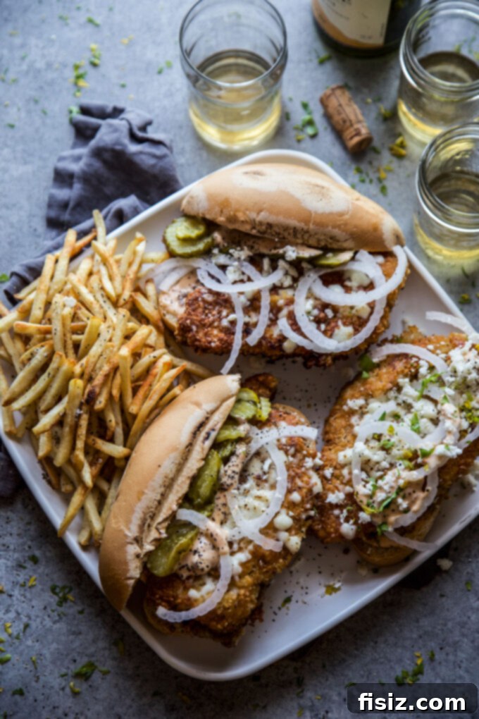 Chipotle Fried Chicken, Queso Fresco Sandwich 8 Stacked Chipotle Fried Chicken Sandwich with Queso Fresco ready to be devoured.
