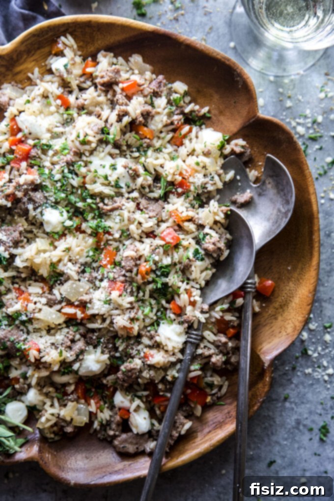 Quick Tuscan Fried Rice 3 Close-up of a skillet filled with Easy Tuscan Fried Rice, showcasing the rich colors and textures of the ingredients.