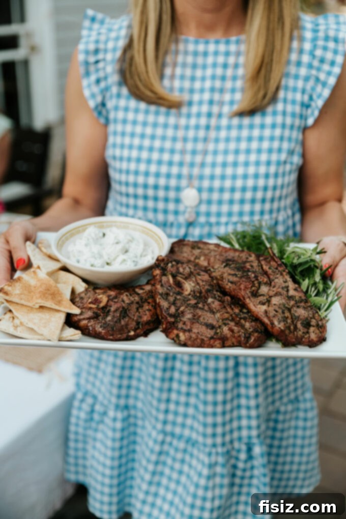 Grilled American Lamb Shoulder Chops, Greek-Style 12 Ingredients for the Greek marinade spread out: fresh herbs, lemon, garlic, olive oil.