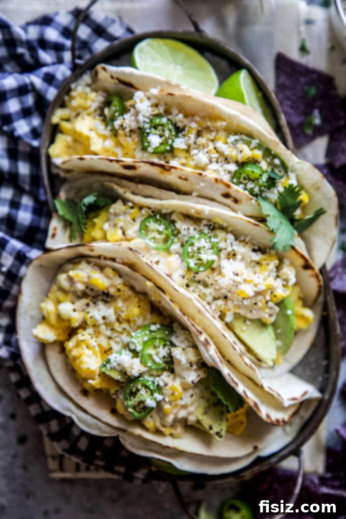 Elote Breakfast Tacos 3 Close-up of freshly prepared Elote-Style Breakfast Tacos with vibrant toppings