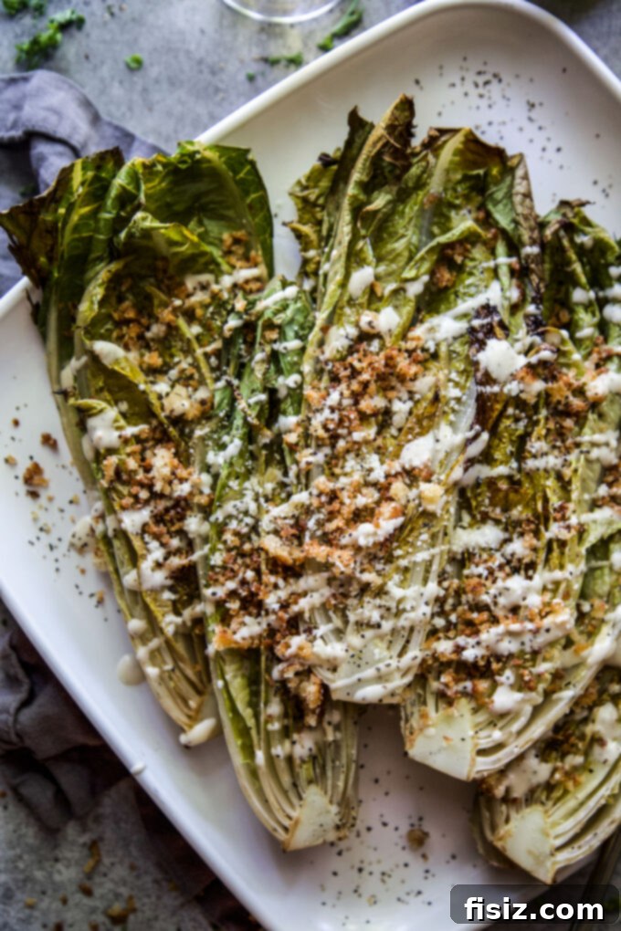 Charred Romaine with Golden Garlic Crumbs 10 A vibrant platter of Grilled Romaine Salad with various toppings.