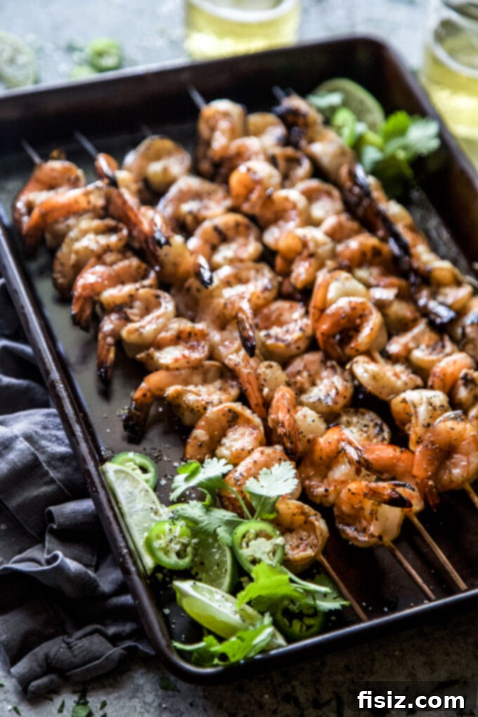 Spicy Citrus Grilled Shrimp Skewers 3 Juicy Chile Lime Shrimp Skewers on the grill, a perfect outdoor cooking choice.