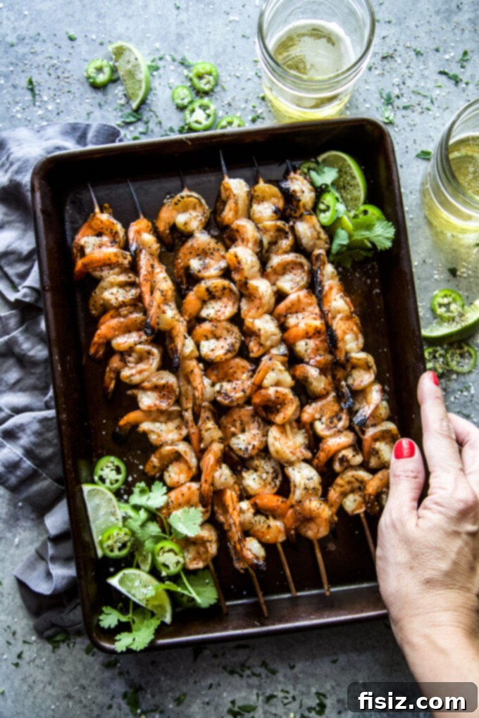 Spicy Citrus Grilled Shrimp Skewers 9 Close-up of perfectly cooked shrimp with char marks and fresh cilantro.