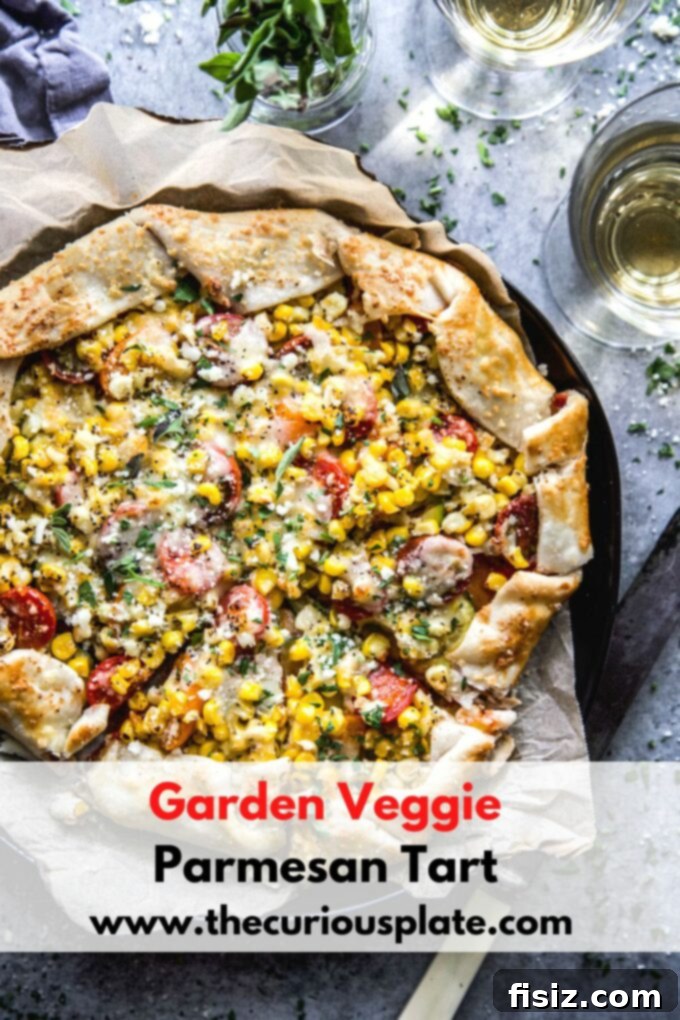 Savory Garden Parmesan Tart 11 A final shot of the whole Garden Veggie Parmesan Tart, garnished and beautifully presented on a serving platter, ready to be enjoyed.
