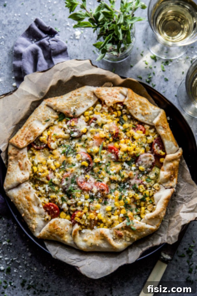Savory Garden Parmesan Tart 9 A slice of Garden Veggie Parmesan Tart on a plate, showing the flaky crust, vibrant vegetables, and melted cheese, ready to be enjoyed.