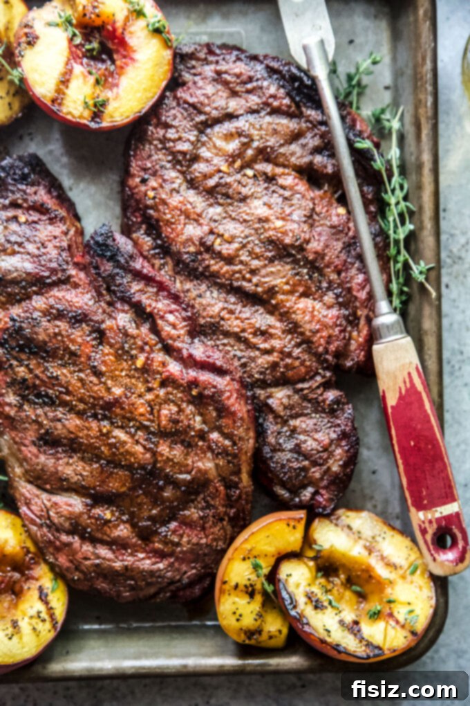 Sweet & Savory Grilled Ribeye with Peaches 3 grilled ribeye steaks with peaches www.thecuriousplate.com