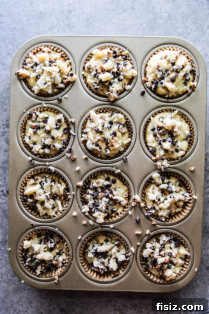 Zesty Orange Chocolate Chip Muffins 8 Muffins with streusel topping before baking