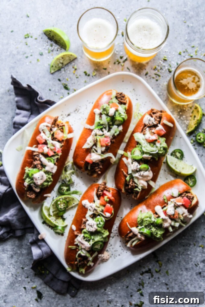 Adobo-Loaded Taco Subs 2 Taco-Stuffed Subs with Adobo Sauce www.thecuriousplate.com