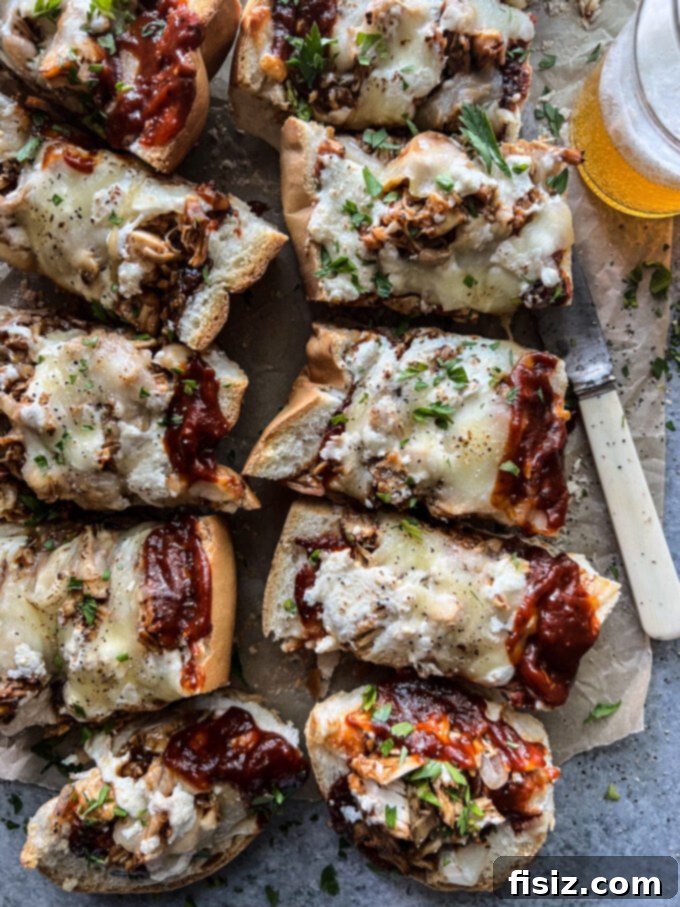 Smoked Mozzarella BBQ Chicken Baguette Pizza 12 Final plated BBQ Chicken Baguette Pizza slices arranged on a board, ready for a party