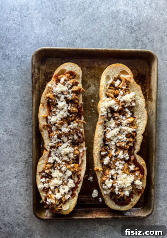 Smoked Mozzarella BBQ Chicken Baguette Pizza 10 Assembling layers of BBQ chicken, caramelized onions, and cheese on a toasted baguette