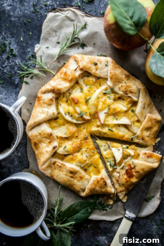 Our Top 30 Cozy Fall Recipes 2 Honeycrisp Tart with Cheddar & Rosemary Honey, a perfect fall dessert showcasing autumnal flavors.