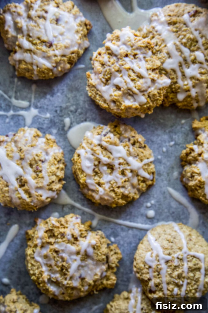 Warm Maple Drizzled Pumpkin Oat Cookies 3 Close-up of freshly baked Pumpkin Oatmeal Cookies with a drizzle of maple glaze