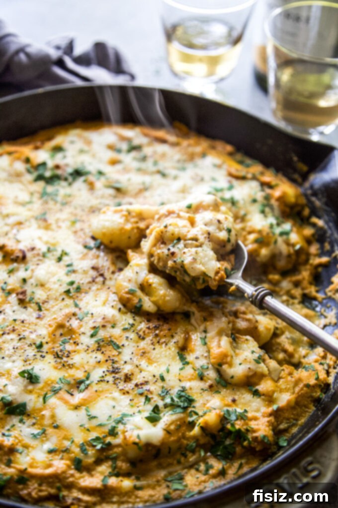 Cozy Pumpkin Gnocchi Skillet Bake 3 Perfectly baked one-skillet pumpkin gnocchi, golden and bubbly