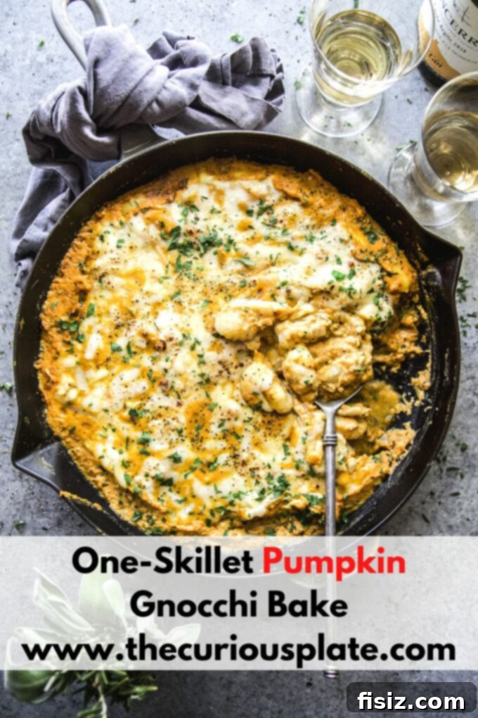 Cozy Pumpkin Gnocchi Skillet Bake 10 One-skillet pumpkin gnocchi bake garnished with fresh herbs and bacon