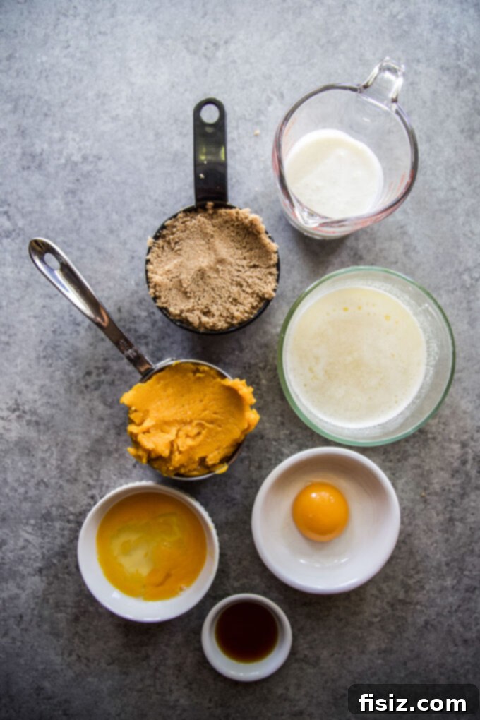 Maple Kissed Baked Pumpkin Doughnuts 5 Wet ingredients for baked pumpkin doughnuts in a bowl