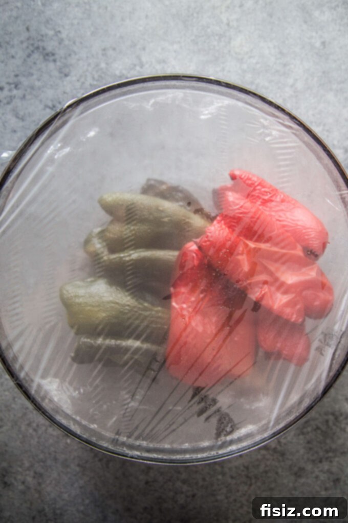 Charred Tomato Poblano Bisque 6 peppers and poblanos covered in a bowl with plastic wrap