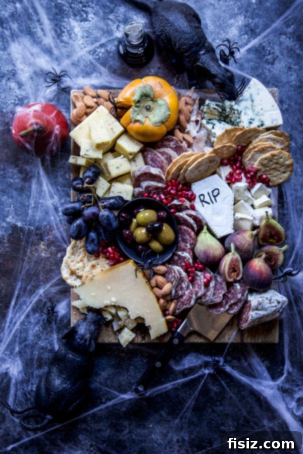 Wickedly Easy Halloween Bites 3 A beautifully arranged Spooky Halloween Charcuterie Board, featuring themed cheeses, fruits, and snacks, perfect as an easy Halloween appetizer.
