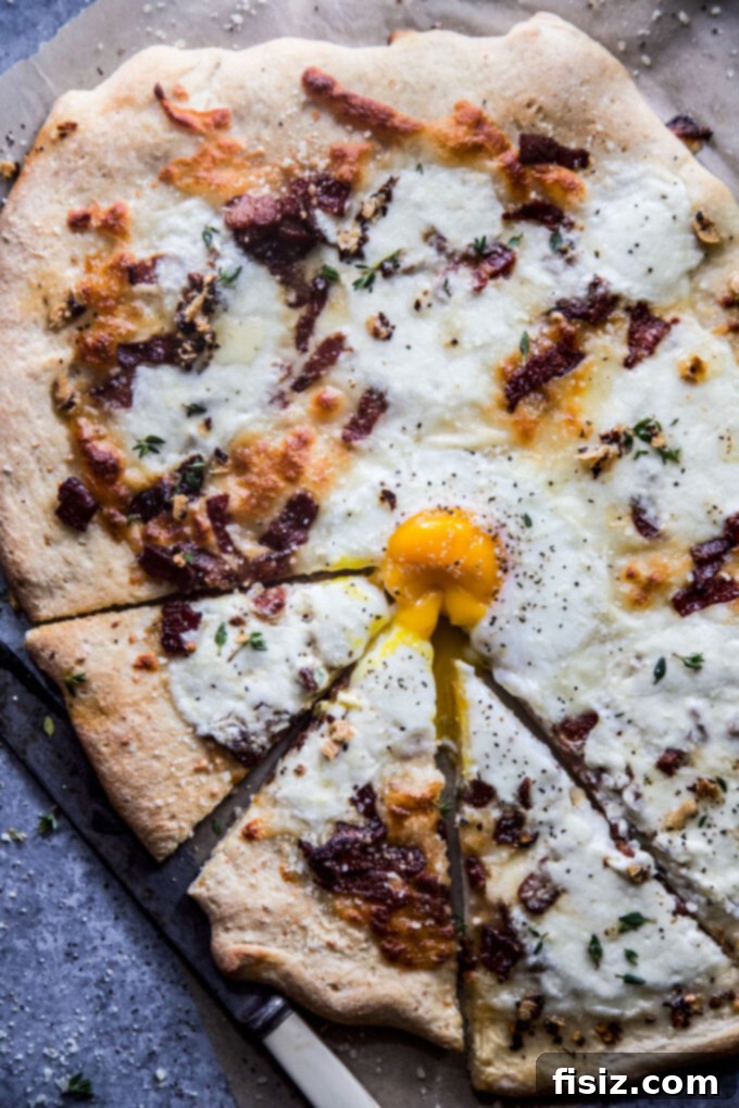 Effortless Burrata Carbonara Pizza 3 Easy Carbonara Pizza with Burrata - close-up of the runny egg and crispy bacon