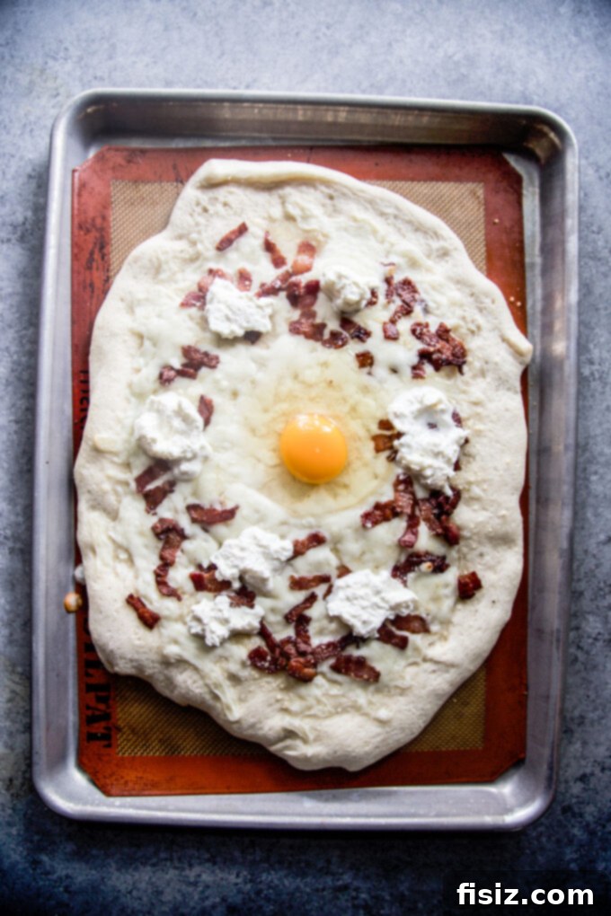 Effortless Burrata Carbonara Pizza 6 Adding cheese and bacon to Carbonara Pizza