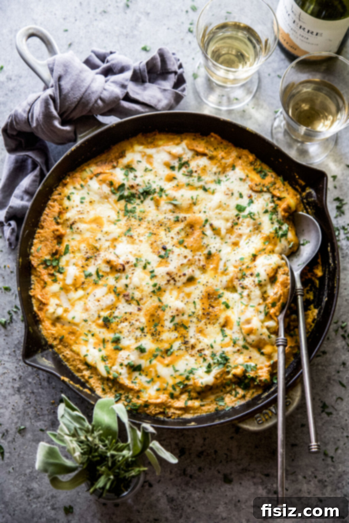 Whip Up These 27 Pumpkin Recipes Today 7 A hearty and comforting Pumpkin Gnocchi Bake, garnished and ready for a satisfying dinner.