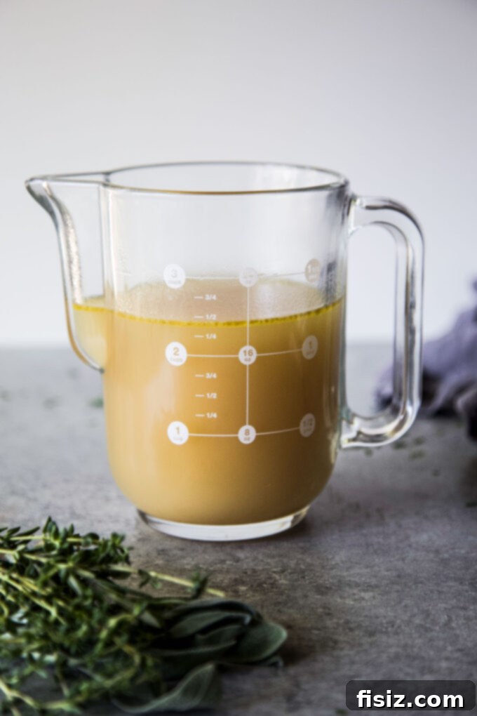 Simple Homemade Turkey Stock 2 Easy Homemade Turkey Stock simmering in a pot