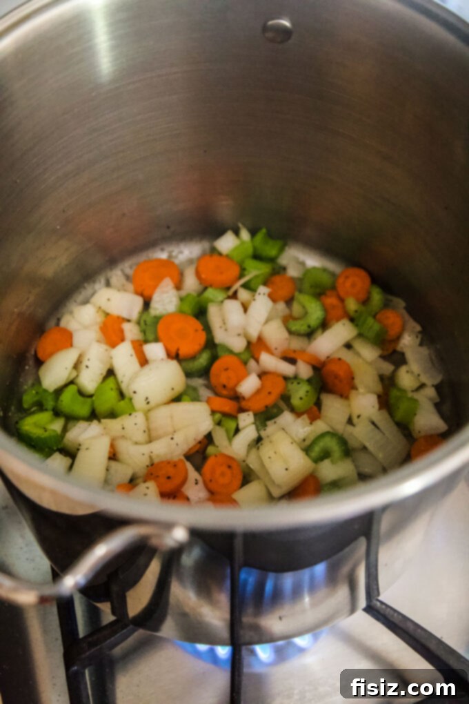 Simple Homemade Turkey Stock 6 Chopped vegetables cooking in a stock pot