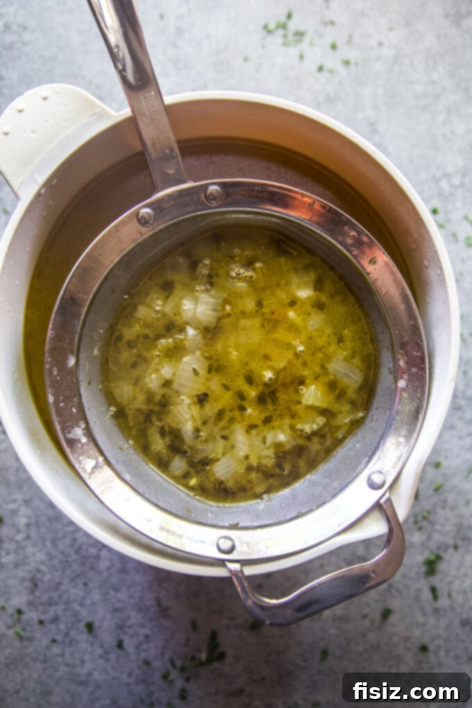 Simple Homemade Turkey Stock 9 Straining the homemade turkey stock to remove solids