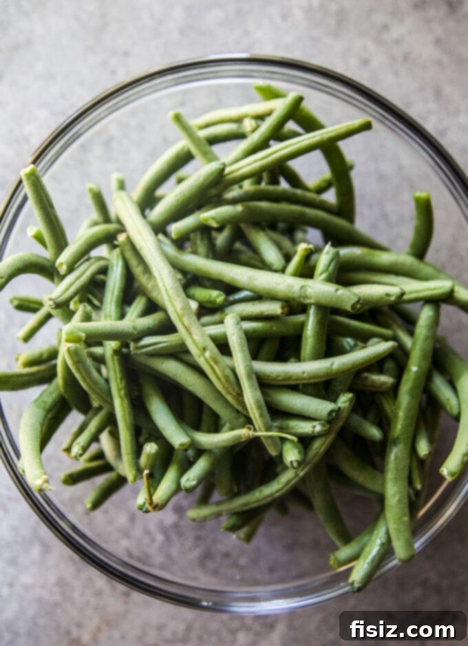 One-Pan Green Bean Casserole 4 fresh green beans in a ceramic bowl