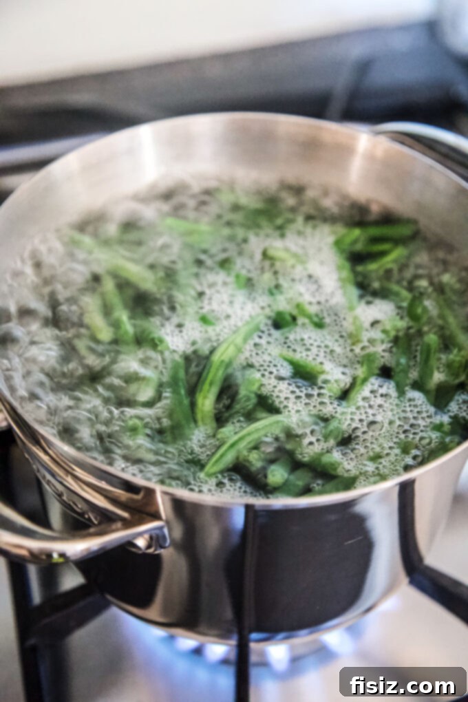 One-Pan Green Bean Casserole 5 green beans boiling in a stock pot for blanching