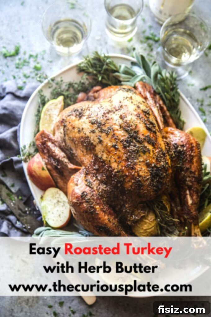 Easy Herb Butter Roasted Turkey 11 Beautifully carved roasted turkey slices on a serving platter with garnishes